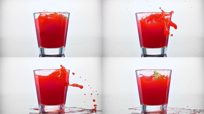SLO MO LD一个草莓掉进一杯红色果汁中