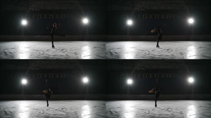 溜冰者在室内溜冰场训练。在体育场进行花样滑冰。这个年轻的女孩表演花样滑冰，后退旋转的元素。