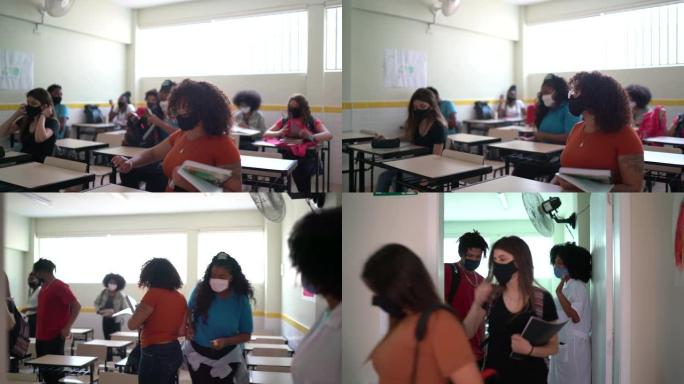 戴着口罩的学生离开教室