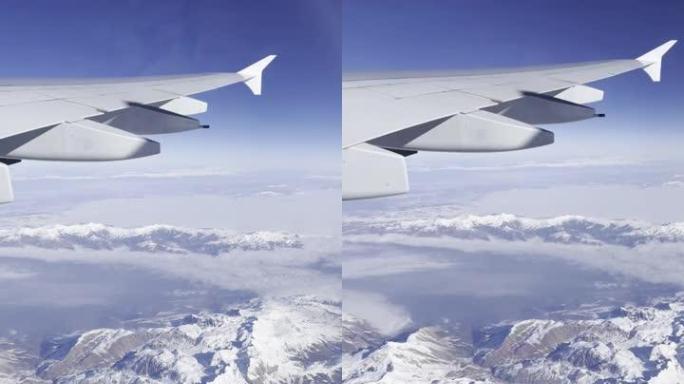 冬天从飞机窗看雪山。
