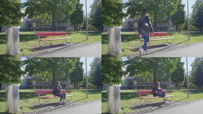 年轻女子走向并坐在公园的长凳上