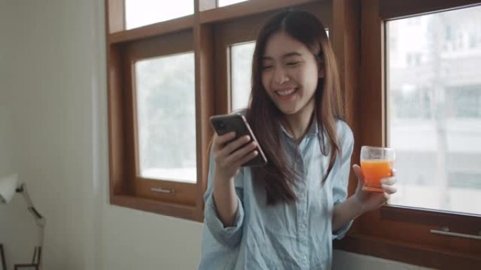 年轻女性在家使用智能手机