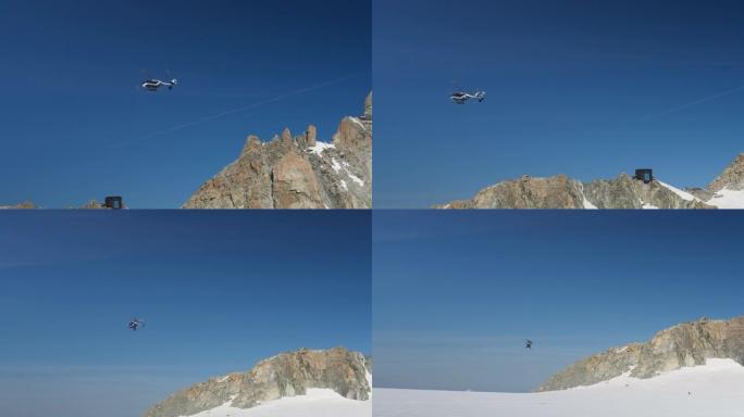 直升机飞越高海拔山区。积雪覆盖的尖峰