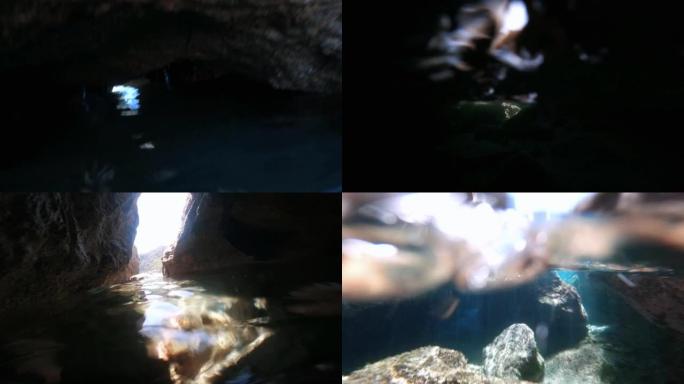 一个男人在海上一个小洞穴下游泳和浮潜的POV