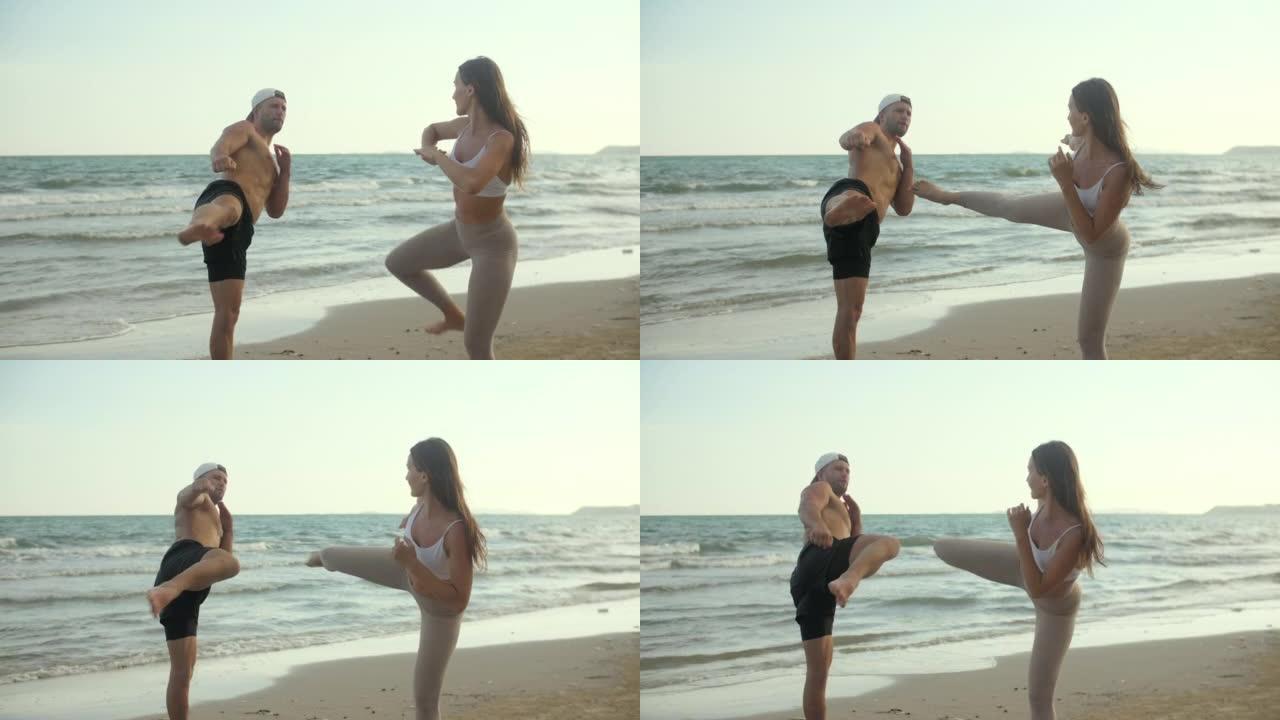 拳击教练在海滩上教女子武术