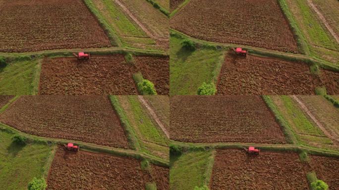 鸟瞰图，农业用拖拉机调整耕作表土。