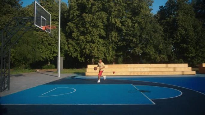Basketball player practises game to throw ball int