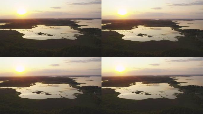 宁静的风景。波兰马苏里亚地区的日落湖。夏天，无人机景观