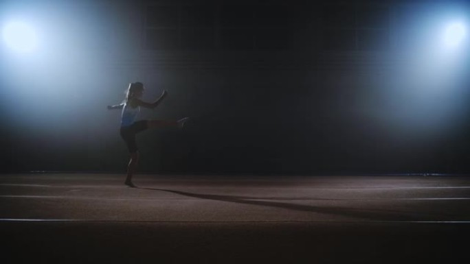 年轻的女运动员在春季地板上进行跳跃，艺术体操的自由体操，慢动作射击