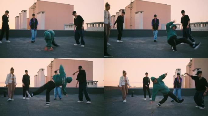 酷b-boy在屋顶上跳舞，青年派对中的街舞大战，现代舞表演