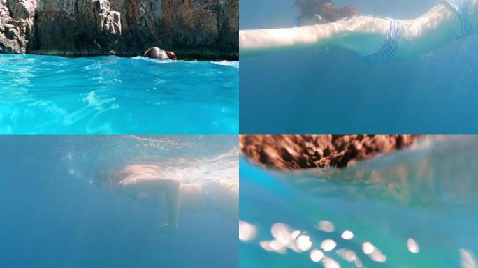 女人深呼吸，潜入大海。夏季带面罩浮潜