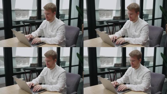 自由职业者正在咖啡馆使用笔记本电脑，使用无线互联网和wifi，通过电子邮件发送消息