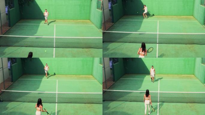 夫妇在网球场上。激烈的比赛