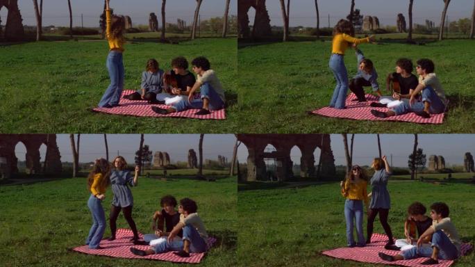 年轻女子在公园跳舞，一位朋友坐在草坪上