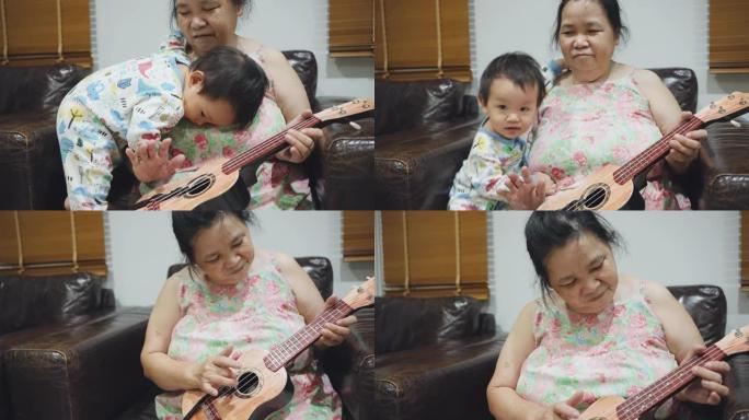 奶奶在家里的客厅里为她蹒跚学步的男孩弹吉他