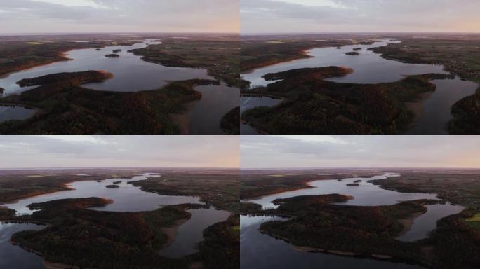 森林和湖泊的鸟瞰图。马苏里地区的日落