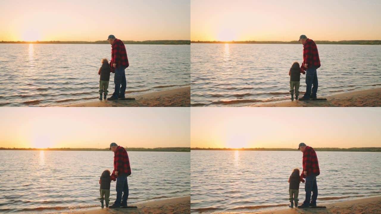 祖父在教小孙子用钓鱼竿，老人和蹒跚学步的人在河边的沙滩上捕鱼