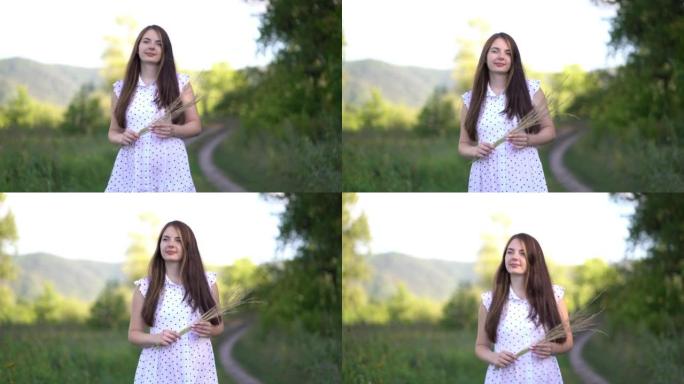 Pregnant young woman walks outdoors.