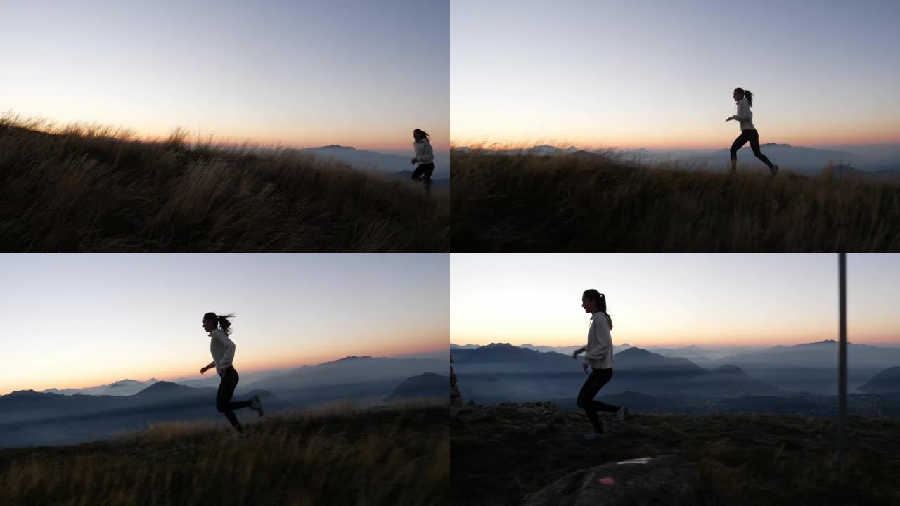 在日落时分，一名年轻女子在山上奔跑的镜头之后