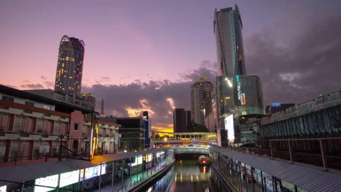 日落时间照明曼谷市中心著名夜市船站运河全景4k延时泰国