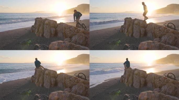男子在海滩岩石上放松，向海望去
