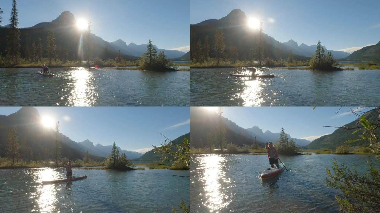 女人在站立的桨板上探索山涧和湖泊 (SUP)