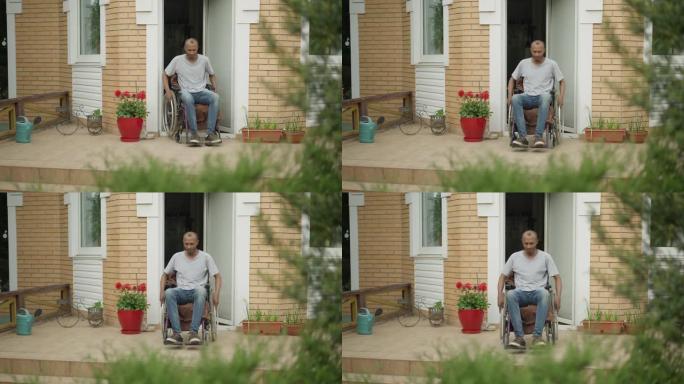 瘫痪的非洲裔美国人在户外后院门廊上骑轮椅。春夏户外集中的成年残疾人。医学概念。
