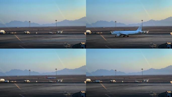 沙漠山区的机场。飞机降落和起飞。机场登机高峰时间，延时