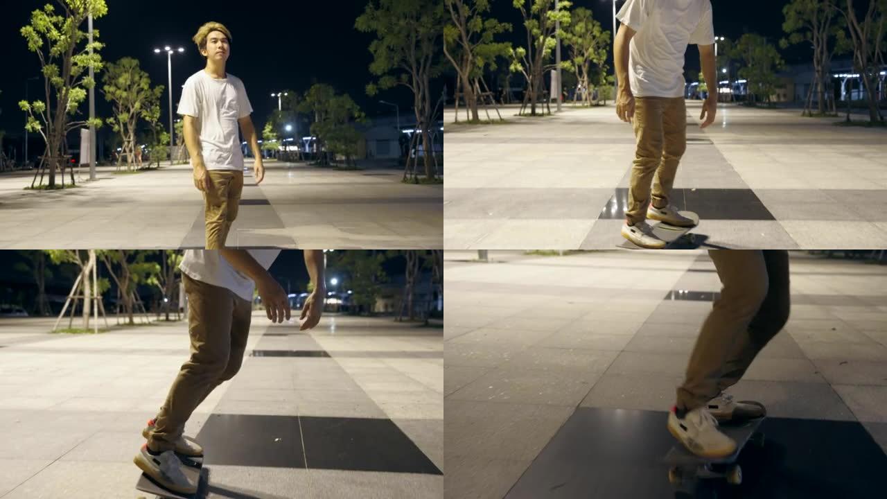 亚洲青年男子在夜城溜冰场滑板