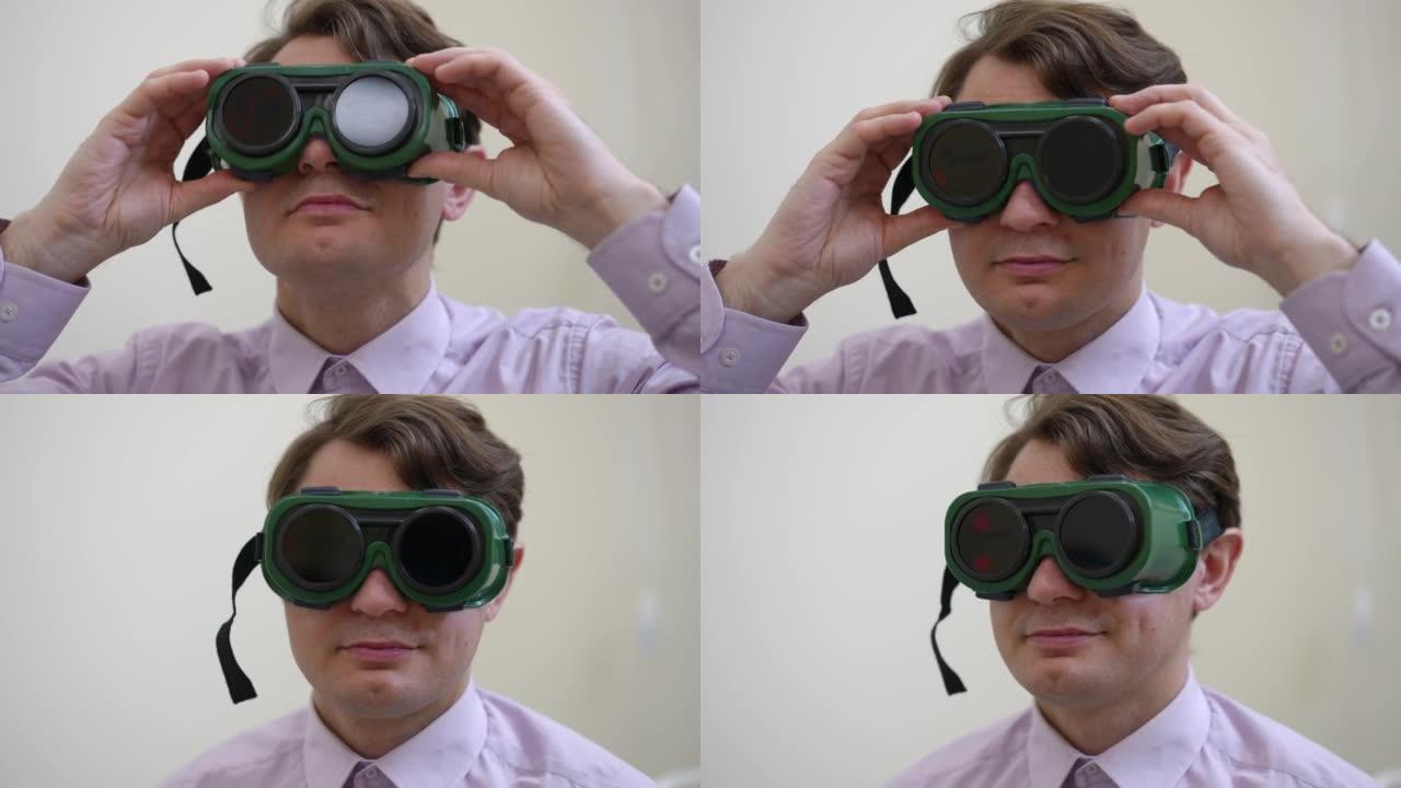 自信的男人看着相机戴上眼镜进行色盲测试的前视图头像。在医院接受体检的白人男性患者。