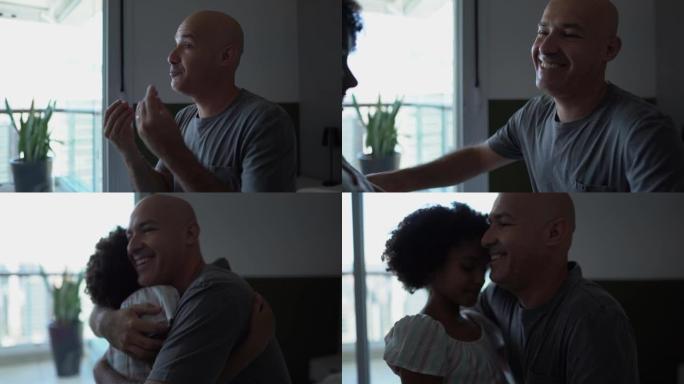 女儿与聋哑的父亲交谈并在家里拥抱他