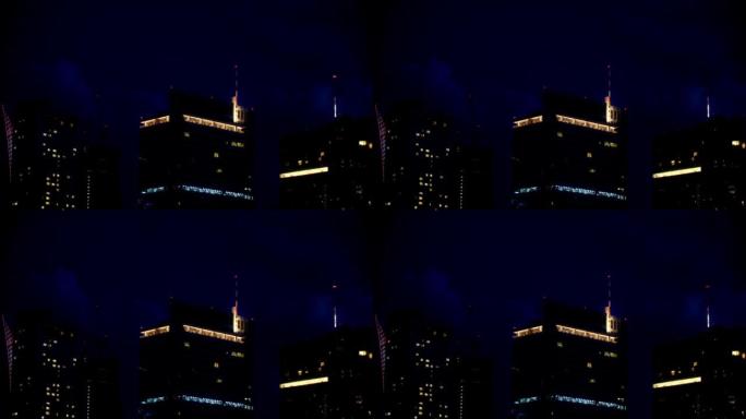 空中拍摄一座拥有现代摩天大楼的城市在夜间建造