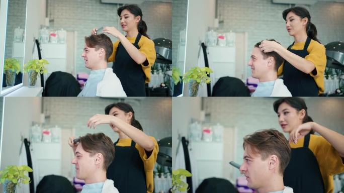 年轻的女理发师在吹干顾客头发时使用吹风机和圆刷