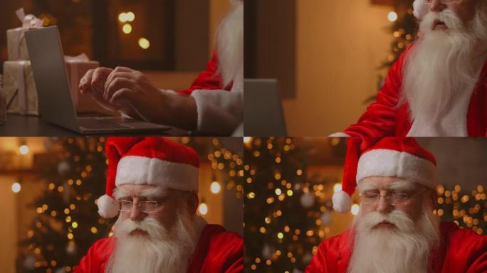 圣诞老人在木制新年装饰桌上用手在无线键盘上打字，圣诞老人正在与笔记本电脑一起工作，通过邮件查找并回复