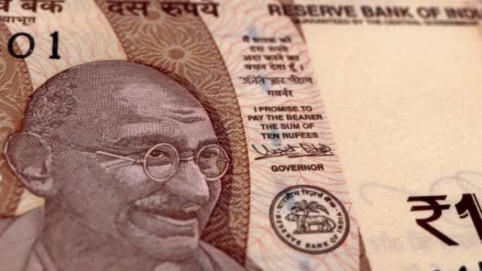 印度印度卢比10钞票，十印度卢比，印度卢比的特写和宏观视图，跟踪和多莉拍摄10印度卢比钞票观察和储备