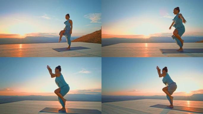 日落时在山上做瑜伽姿势的CS女人