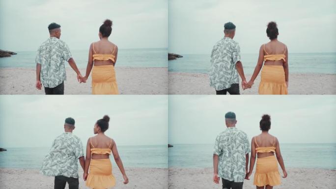 热爱非洲种族的夫妇拥抱。浪漫散步和夏日娱乐看海