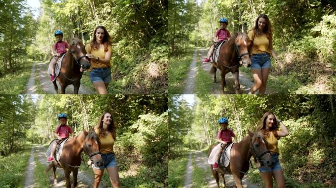 小男孩在树林里骑着母亲的马