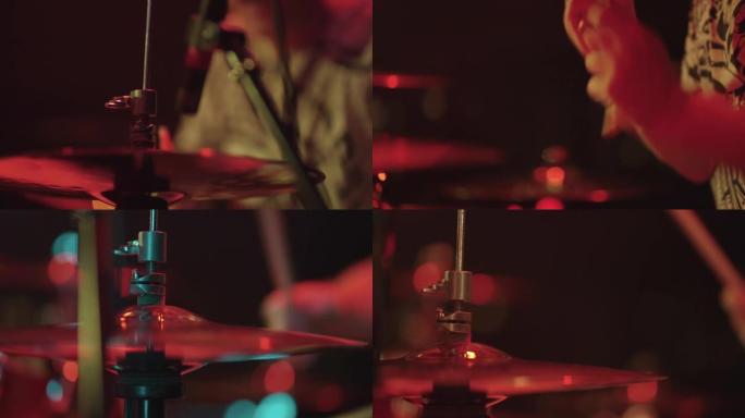 鼓手在摇滚演出中演奏钹鼓，舞台上的特写镜头，乐器和男性面孔