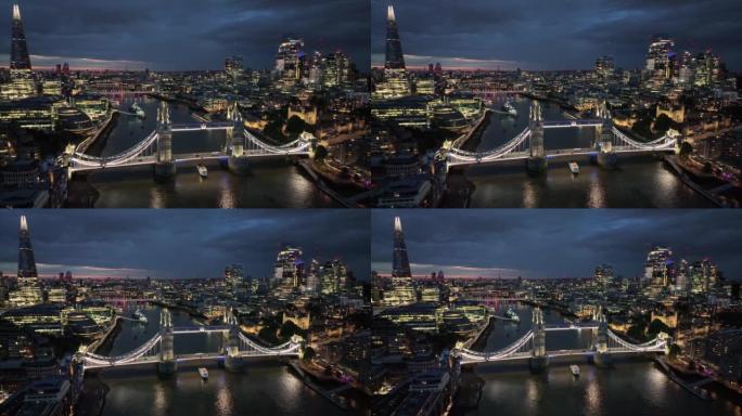 伦敦塔桥在夜晚照亮了泰晤士河