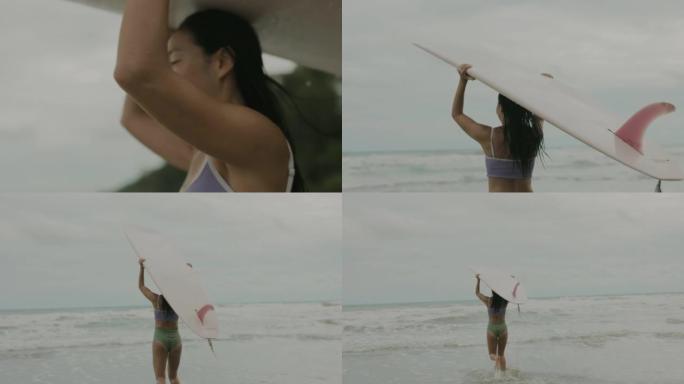 女冲浪者在海上奔跑