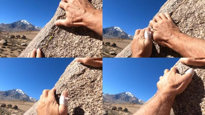 人类手攀登花岗岩巨石的细节