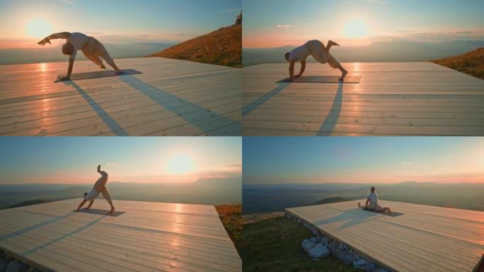 CS男子在日落时在山顶上做瑜伽