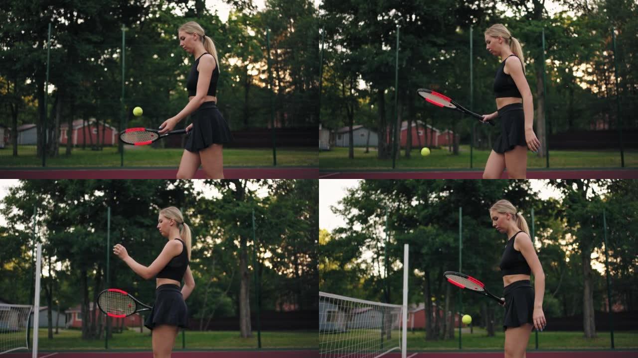 女网球运动员在夏日的露天球场上独自训练，金发女子在弹跳球