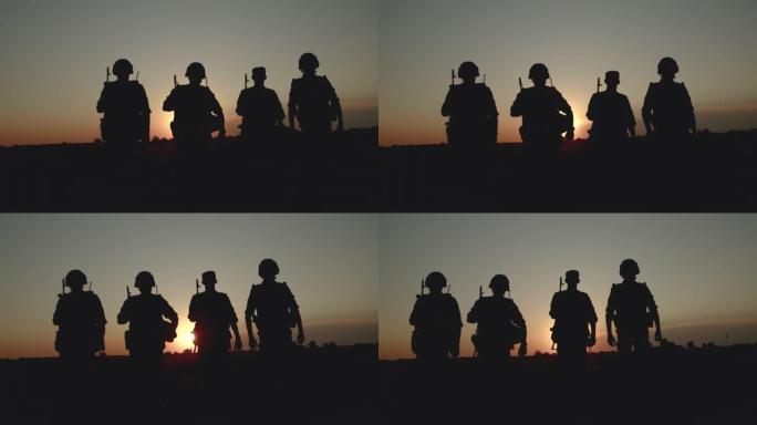 日落时分，带着弹药的狙击手返回家乡的剪影。