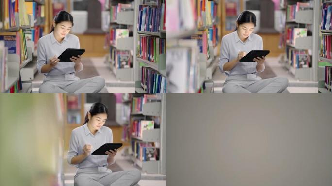 在亚洲的大学图书馆，亚洲女性正在通过图书馆的平板电脑搜索互联网。
