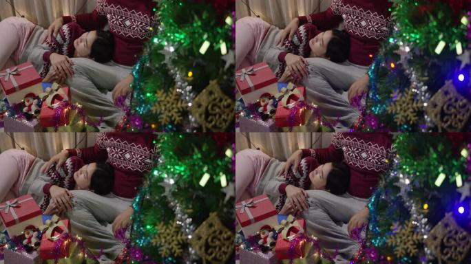 亚洲夫妇在家里的客厅为圣诞节送礼物