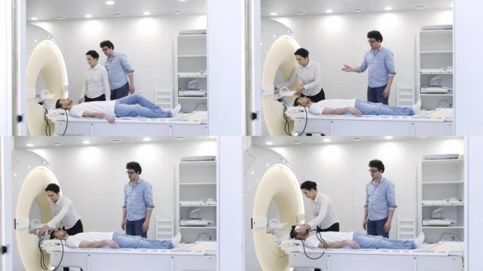 医生在MRI前控制护士如何为患者头部戴上耳机