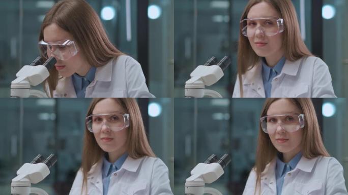 医学实验室工作的年轻女性肖像，探索显微镜仪器的分析