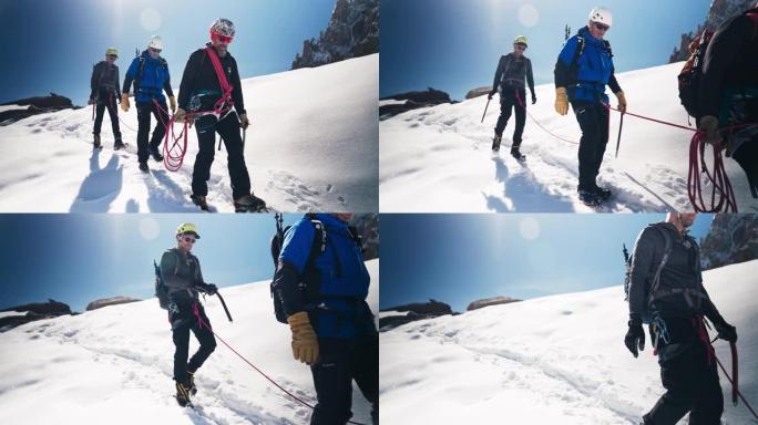 一队登山者沿着陡峭的山峰移动。冬季景观